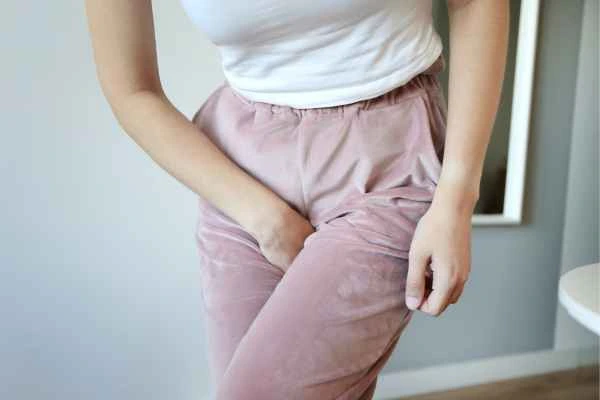 woman running for the toilet because of urinary incontinence West Kensington